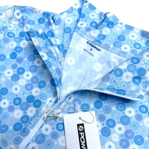 Blue patterned fabric with a brand tag on a white background