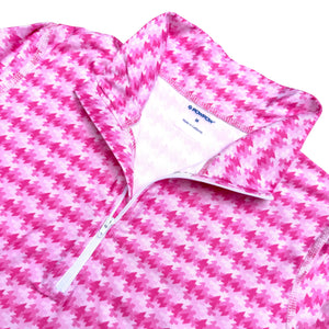 Pink and white checkered fabric with a brand label on a white background